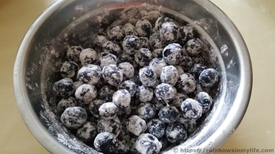 Blueberry Muffins - berries in flour